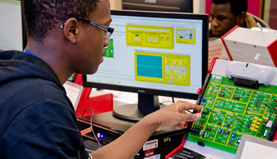 Student working on a circuit board