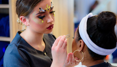 Student applying makeup
